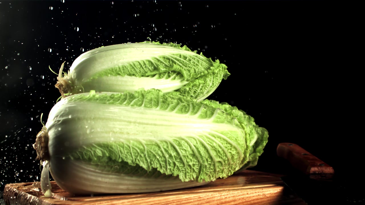 Slow Motion Water Splashing on Fresh Napa Cabbage