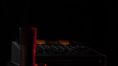 microphone in the studio on the air with a mixing board