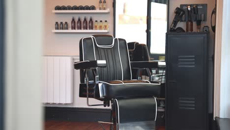 side to side reveal of leather barber shop in hair stylist business