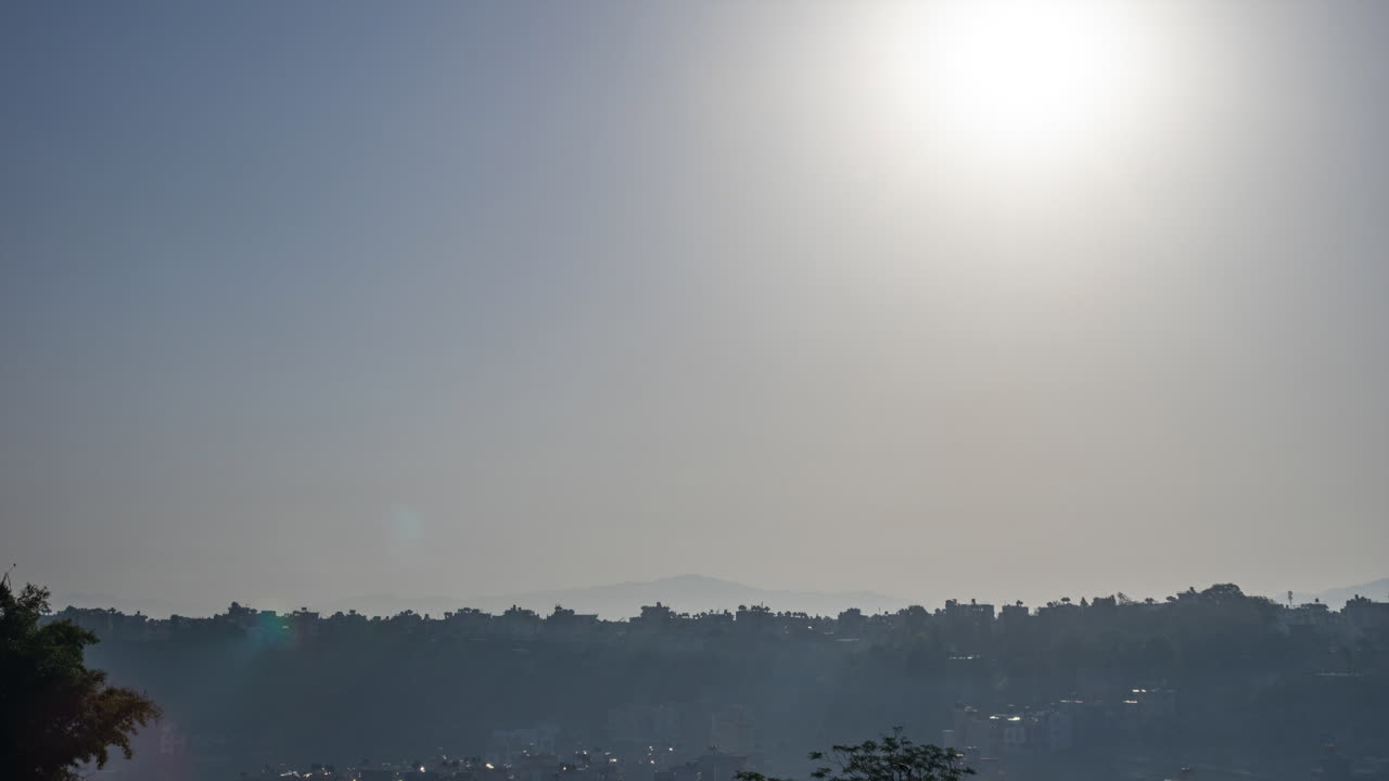 The sun rising over the city of Kathmandu, Nepal in time-lapse.