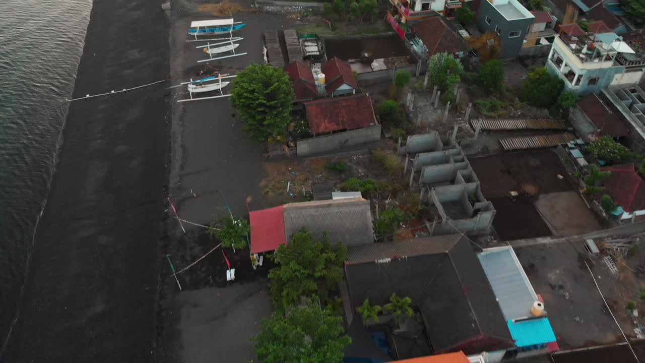 Drone flying over Amed beach at sunrise
