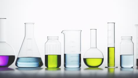 Seamless-looping-animation-of-laboratory-glassware-filled-with-colorful-liquids.-Multi-colored-light-passes-through-the-glass-beakers,-flasks-and-liquids-with-caustic-effect.-Concept-of-science,-lab