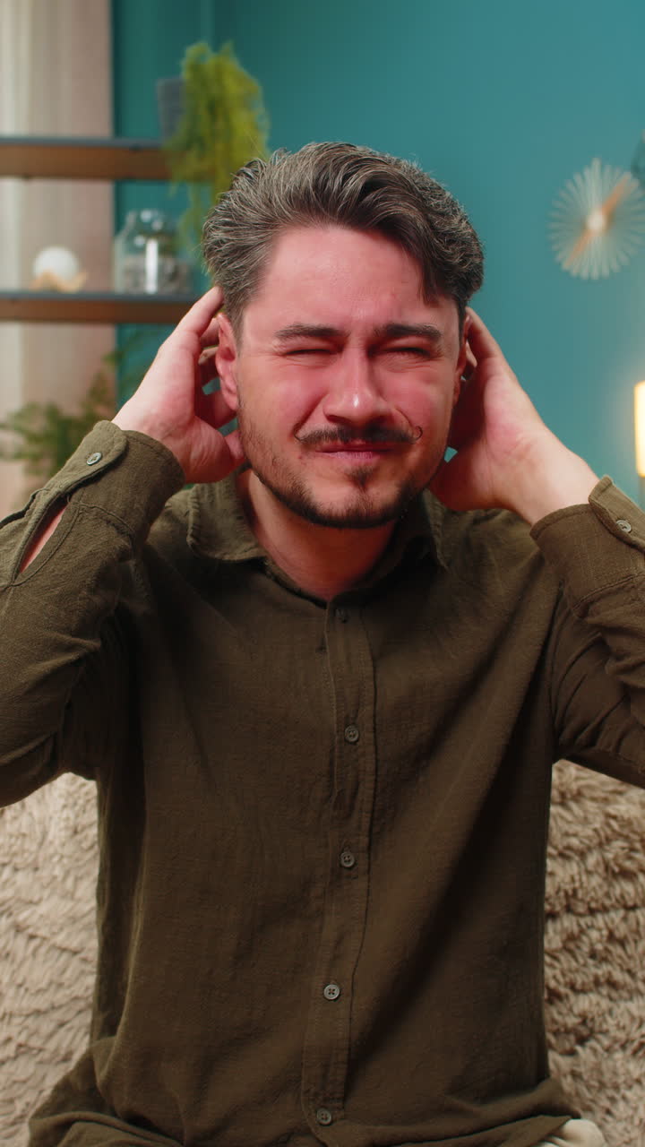 Middleaged man massaging aching head suffers headache tension migraine pain seeking relief comfort