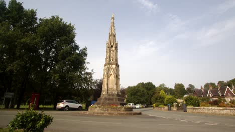 wide shot of a stone monument, park cross