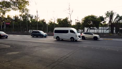 static shot of the movement of cars and public transportation on avenida insurgentes norte in mexico city
