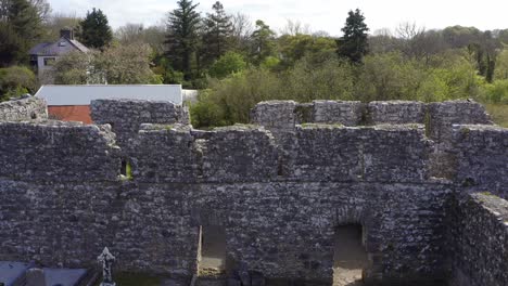 aerial ascent and tilt of the walls of annaghdown abbey