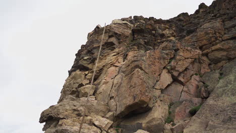 slow motion driving past a rock face