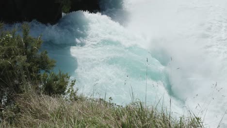 detail of huka falls waterfall on a sunny day in taupo, new zealand