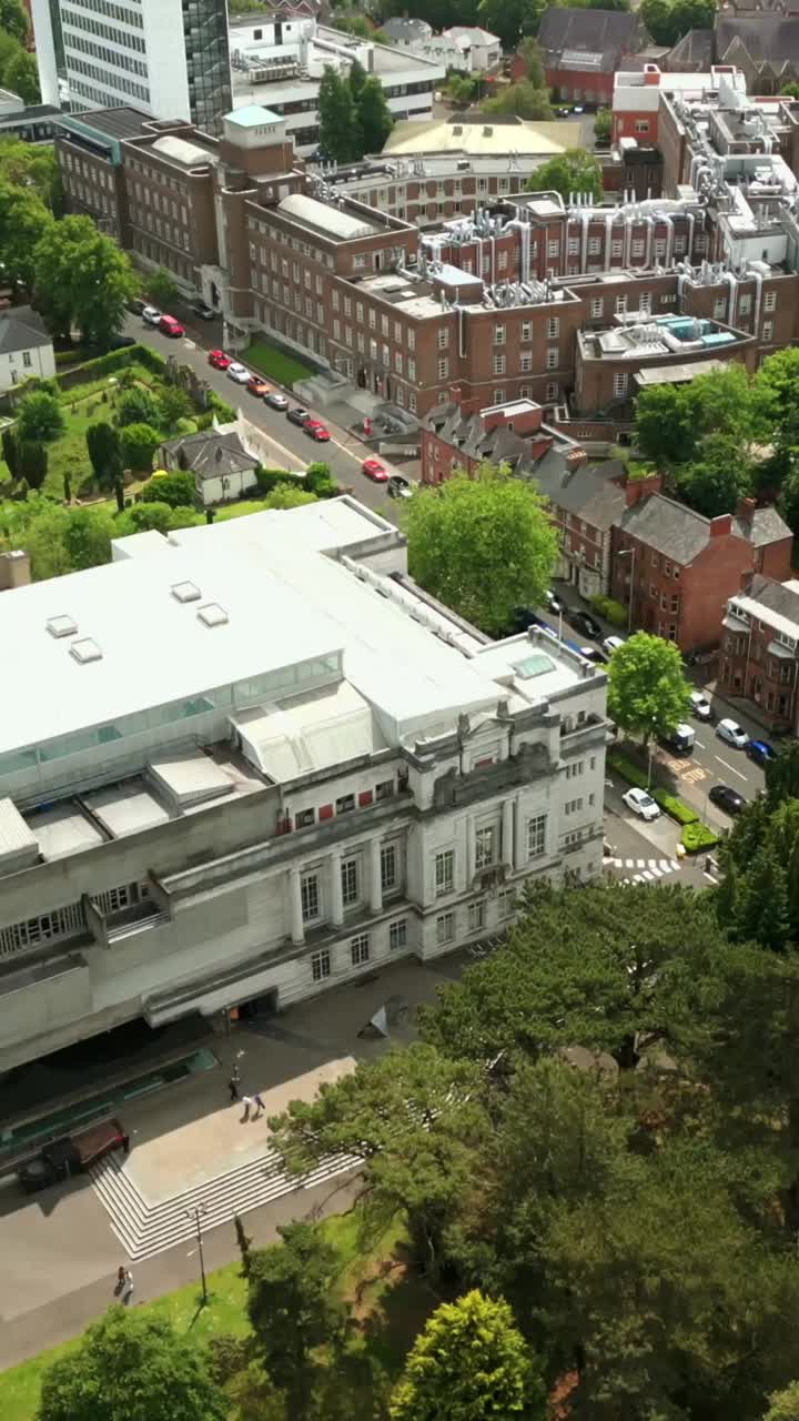 Side-on social ratio aerial video of Ulster Museum and Botanic Gardens in Belfast on a bright and sunny day. Filmed in 1080x1920, 60fps and with Rec709 color