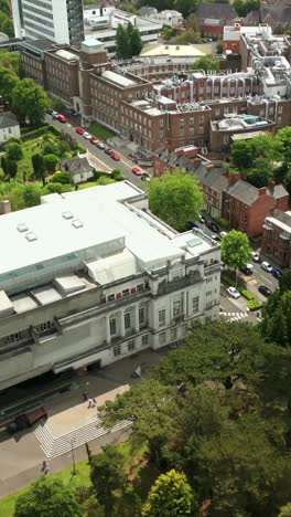 side-on social ratio aerial video of ulster museum and botanic gardens in belfast on a bright and sunny day. filmed in 1080x1920, 60fps and with rec709 color