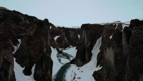 Ascending-over-beautiful-Fjaðrárgljúfur-canyon-in-South-Iceland---Aerial-landscape-footage