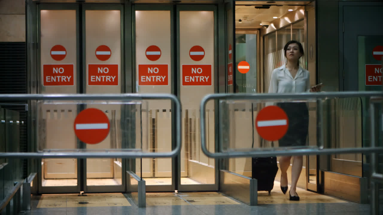 Commuter walking out from exit area 4k