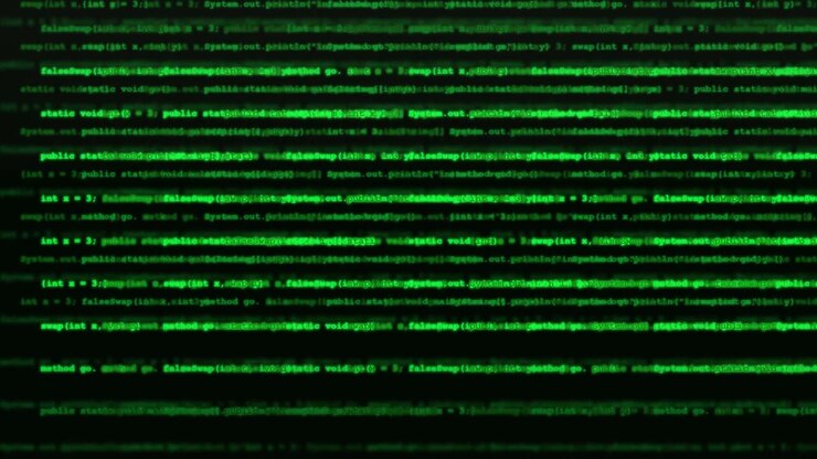 Scrolling Green Computer Programming Code on Dark Background