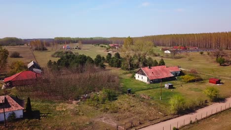 aerial view of a countryside landscape with meadows and farmhouses