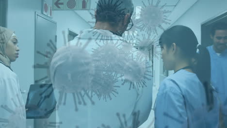 covid-19 cells moving against team of doctors examining xray