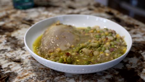 Baked-catfish-with-hominy-in-a-spicy-sauce-in-a-serving-bowl