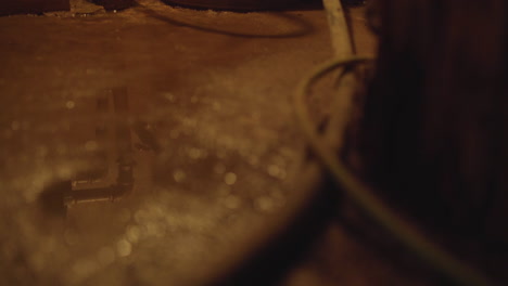 Creepy-puddle-on-the-floor-in-a-dark-dingy-basement