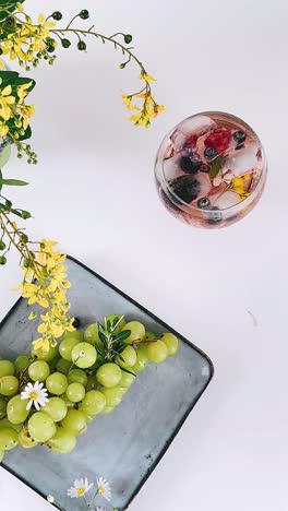 summer refreshment with flowers and grapes