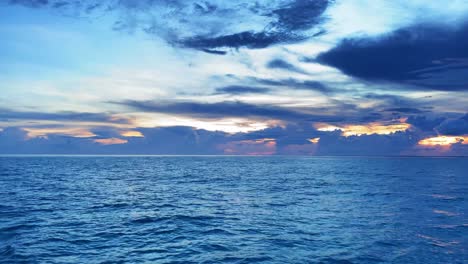 clip of the ocean and the horizon covered with beautiful colors of the sunset in florida keys,usa