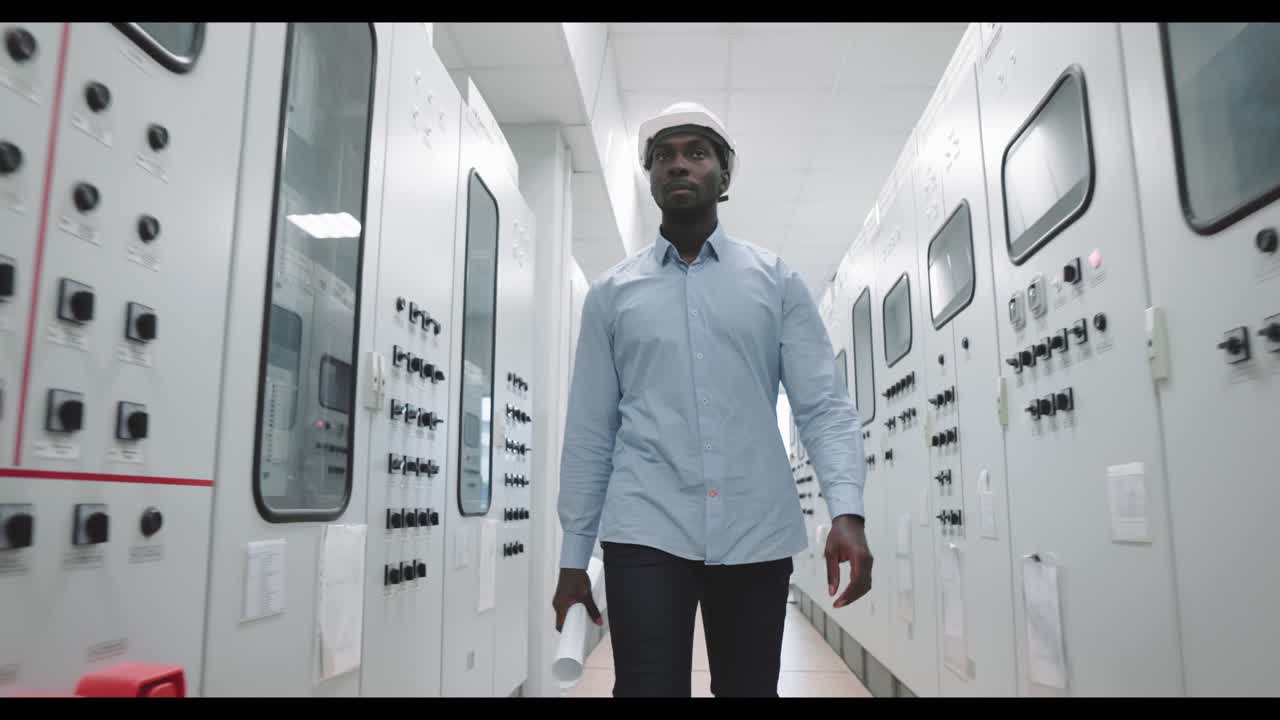 Engineer walking in a control room