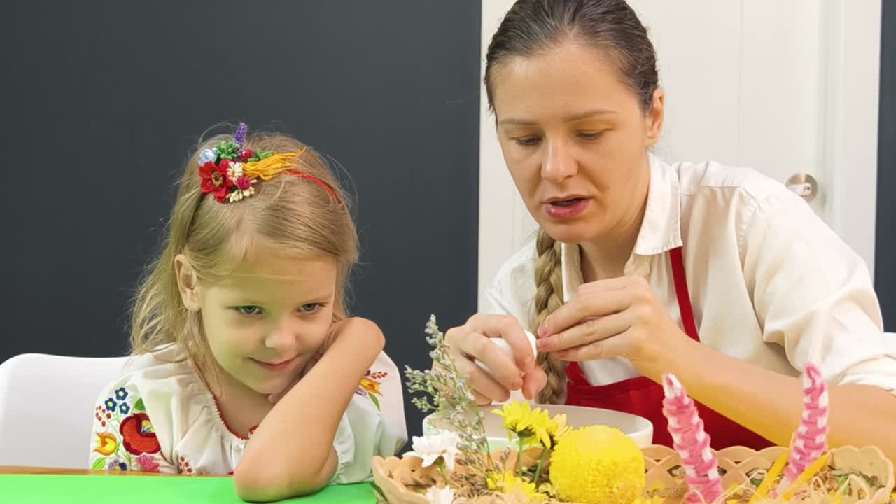 Woman teaching a girl about floral arrangements