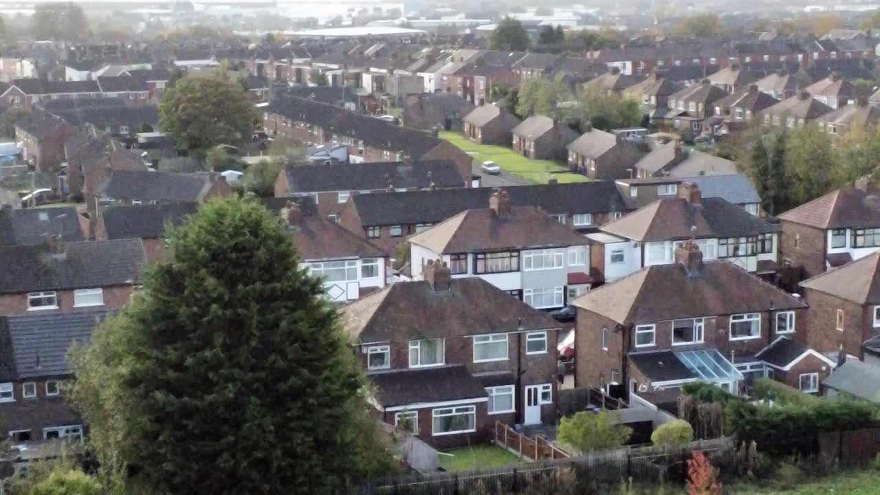 Typical northern English town suburban housing estate aerial view reverse orbit right