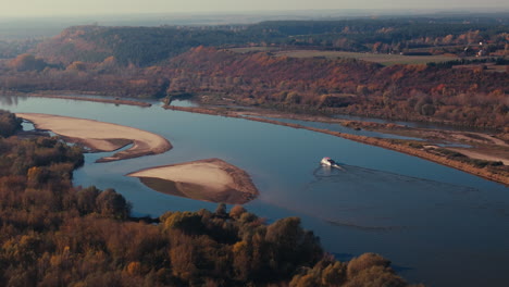 autumn river landscape with boat