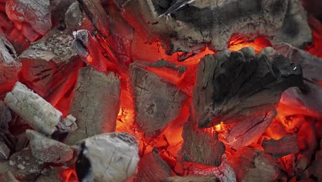 close-up of hot coals burning in a grill