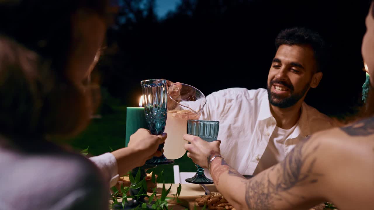 People enjoying dinner together at night