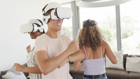 Young-Asian-man-and-biracial-women-enjoy-VR-games-at-home