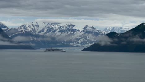 A-cruise-ship-in-Disenchantment-Bay-alongside-Hubbard-Glacier,-Alaska