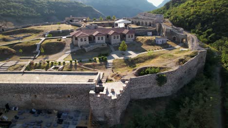 Stone-walls-of-fortress-and-ancient-buildings-at-sunrise-in-Prizren-city,-Kosovo