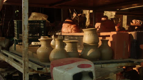 discover the ancient art of traditional pottery in thanh ha village, vietnam, where skilled artisans shape, dry, and fire clay pottery under the sun