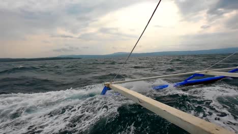 big waves splashes over the water craft