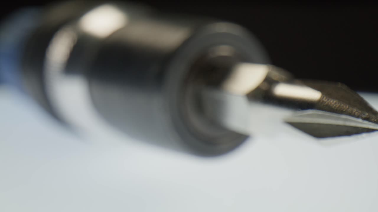 Phillips head screwdriver with macro video close up moving in a circle.