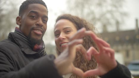 Couple-Making-Heart-With-Hands