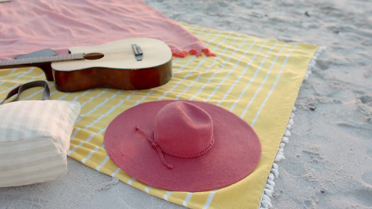 Red hat sitting on towel fourth frame making floating badges stacking and spreading for marketing