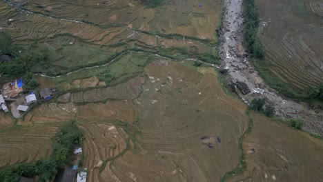 stunning aerial view of the fields and beautiful cloudy mountains in the village of sapa, vietnam