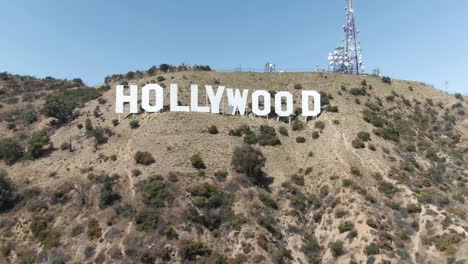 an approaching aerial shot of the hollywood sign