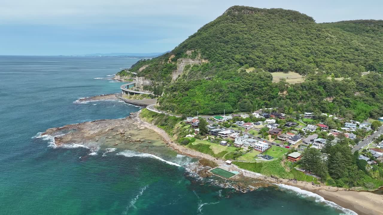 Aerial view of Coalcliff township and coastline near Sea Cliff Bridge on the Pacific Ocean