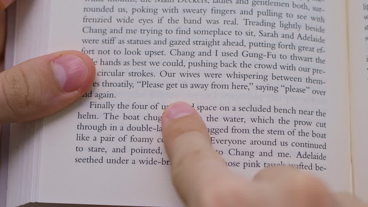 Man disappointed by a slow wi-fi start to read a book. Daily life situations. Brown background. Close up