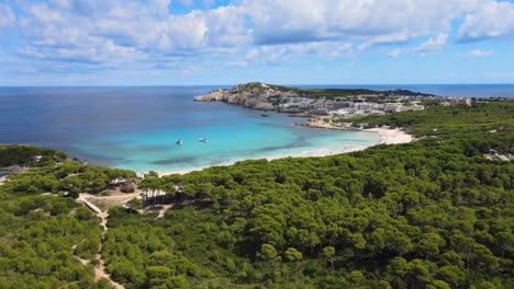 relax and enjoy the breathtaking coastline of cala agulla in cala rajada, mallorca. experience the serene surroundings, azure waters, and vibrant natural landscape. perfect for a calming getaway.