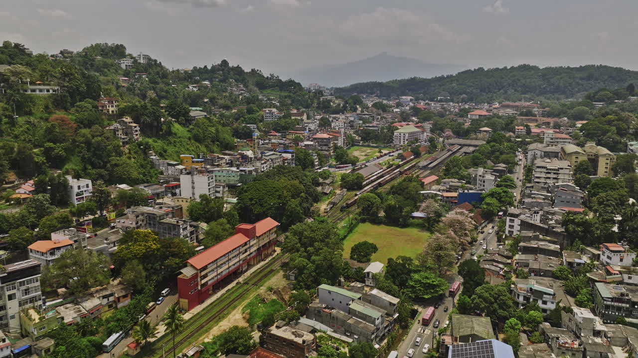 Kandy Sri Lanka Aerial v10 drone flyover the major transportation hub, the railway station in Deiyannewela capturing views of city center and hillside cityscape - Shot with Mavic 3 Cine - April 2023