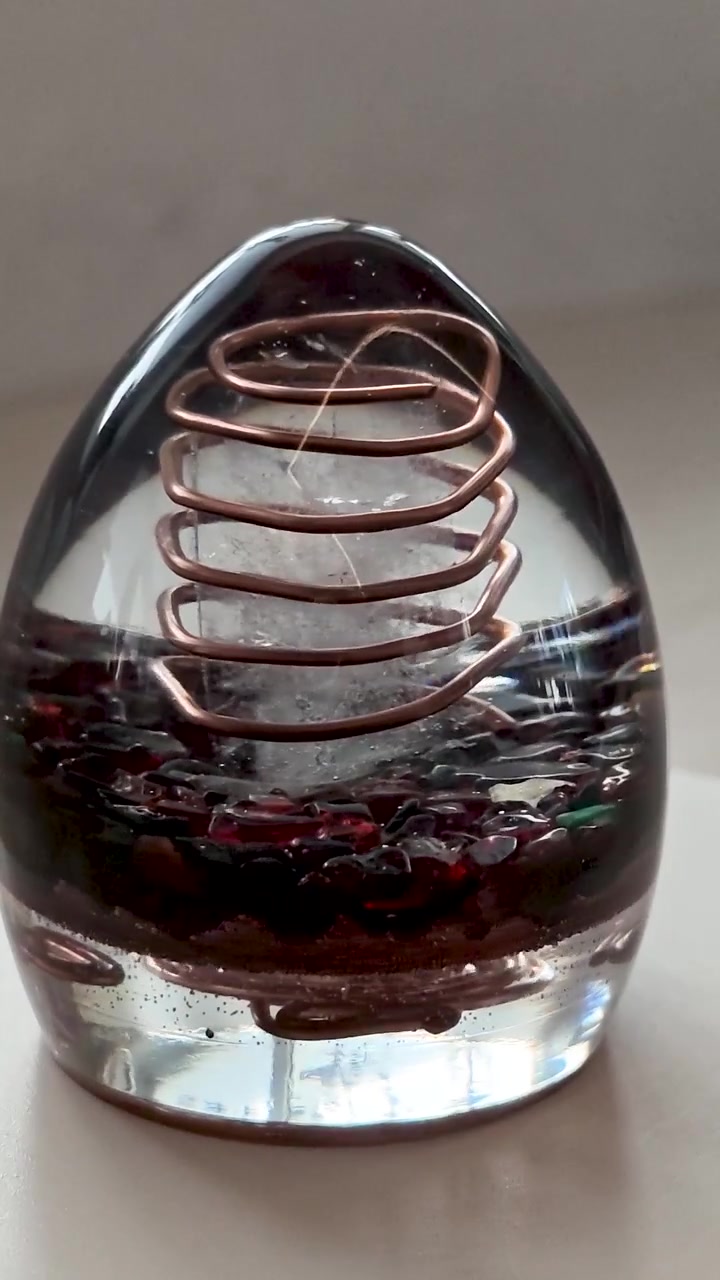 Vertical Video of Rotating Orgone Egg with Black Obsidian Crystals, Handmade Epoxy Resin Crystal Object, Mystical Decorative Design and Spiritual Inspired Concept for Social Media Content