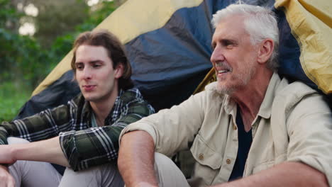 father and son enjoying camping trip