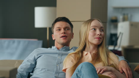 new flat owners looking on living room purchased apartment closeup. new house.