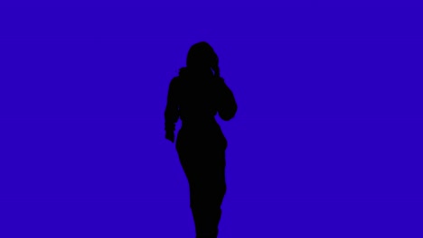 studio silhouette of woman dancing against blue background 1