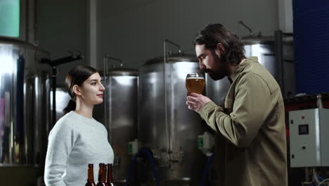 man tasting beer at brewery