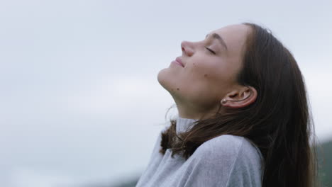 portrait of happy woman looking up smiling enjoying freedom outdoors exploring wanderlust contemplating spiritual journey in countryside breathing fresh air feeling positive