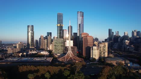 aerial rise up over melbourne arts district, skyline skyscrapers in australia